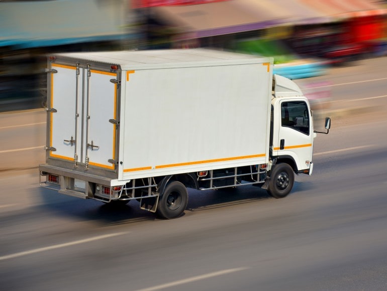 Delivery truck transporting furniture to a customer